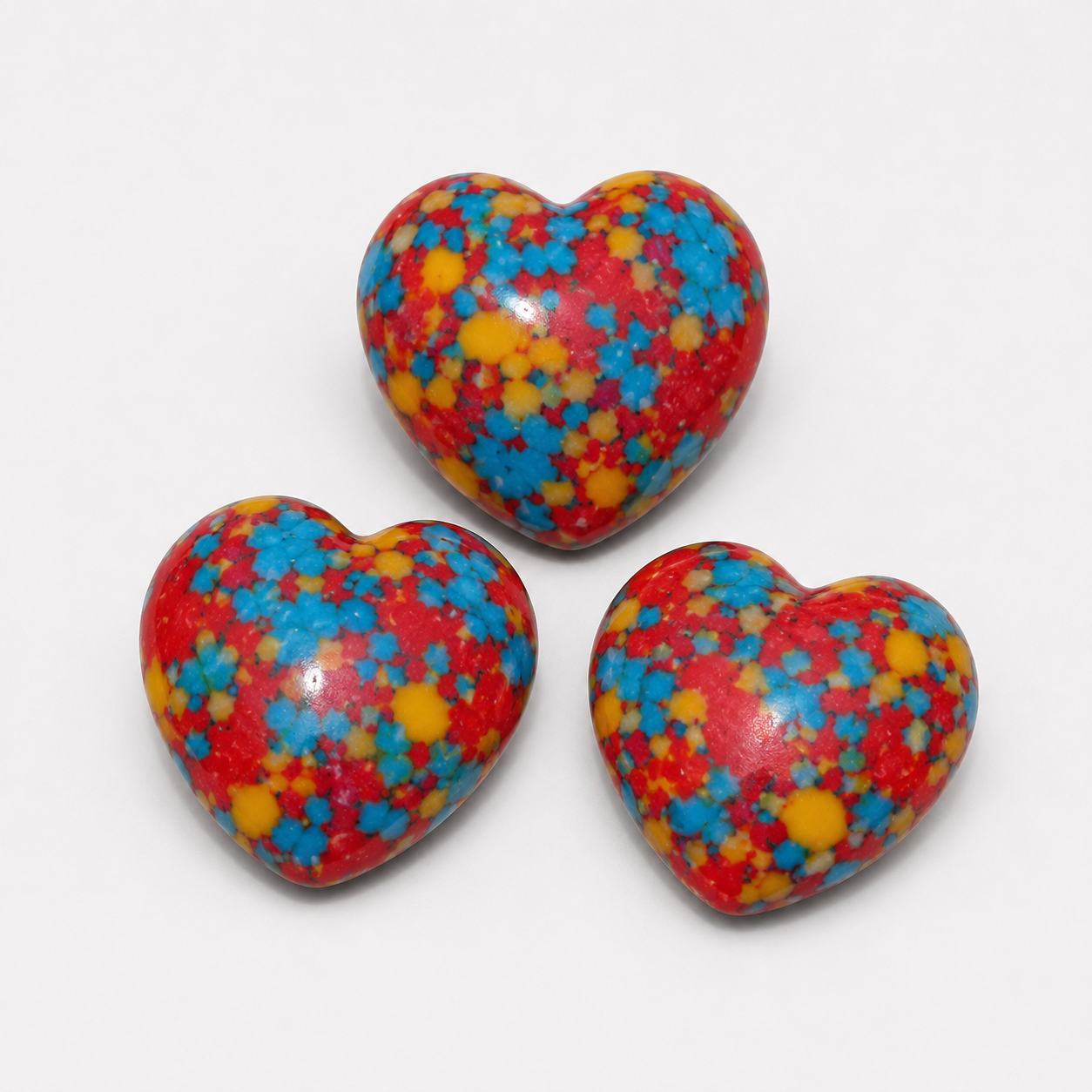 HA Rainbow Mosaic polished crystal heart pocket stones with red blue and yellow colors