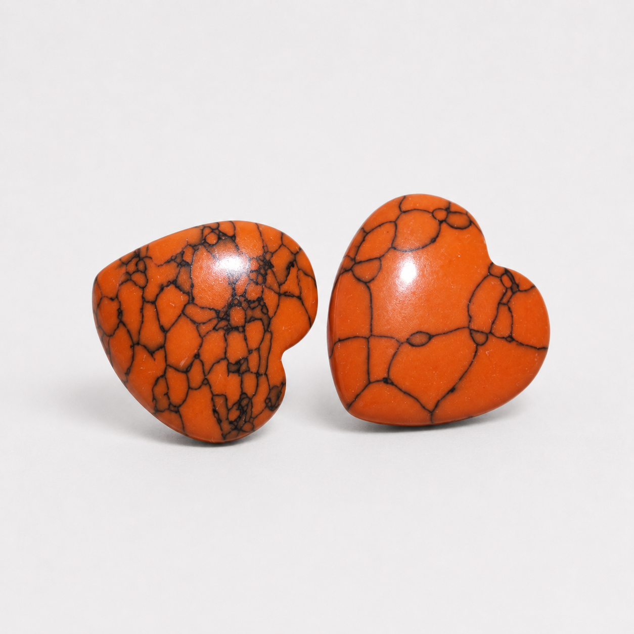 HOC Orange Howlite polished crystal heart pocket stones with dark veining