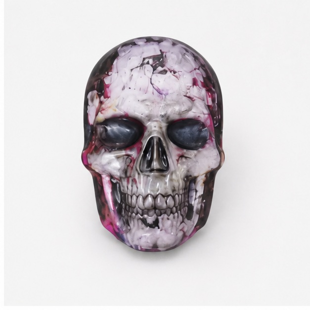 Decorative skull with teal, purple, and pink finish