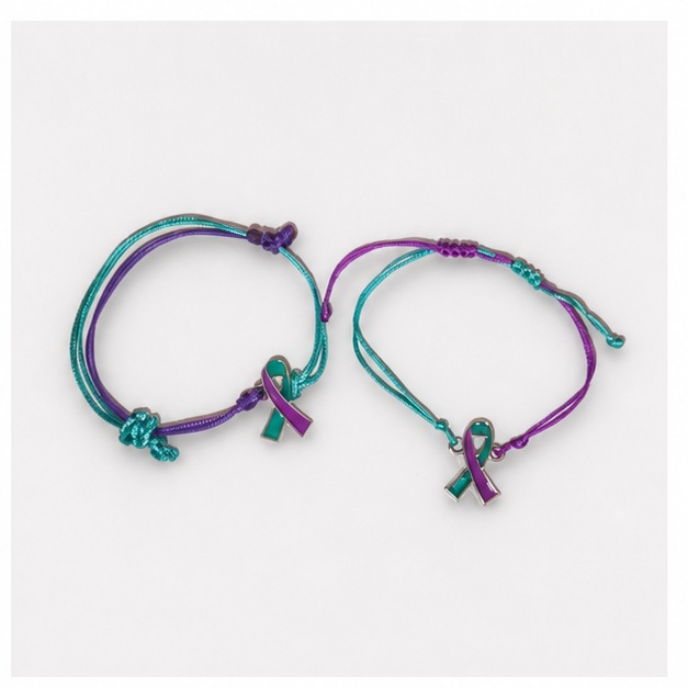 Two string bracelets in teal and purple colors